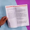 MathBuilders Unit 8 internal pages with hand holding the page