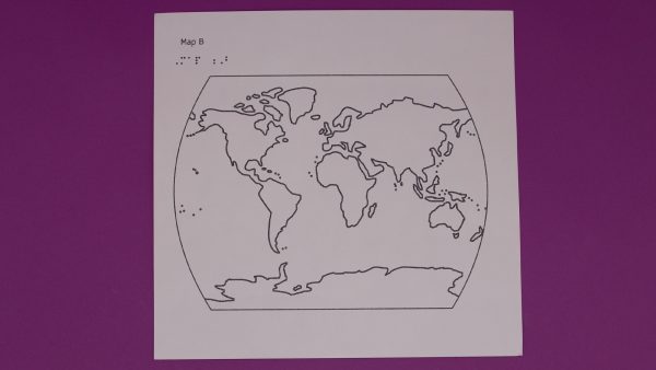 paper map of the earth with braille at top