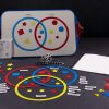 Textured Sorting Circles and Shapes kit with pieces and board. A picture of large textured circles that overlap. Inside are differently textured shapes including stars, circles, triangles, and squares in shades of red, yellow, and blue.