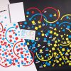 A picture of large textured circles that overlap. Inside are differently textured shapes including stars, circles, triangles, and squares in shades of red, yellow, and blue.