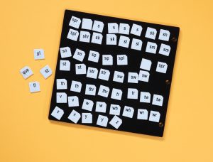 Word PlayHouse kit laid out including black felt board and white word manipulatives.