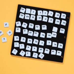 Word PlayHouse kit laid out including black felt board and white word manipulatives.