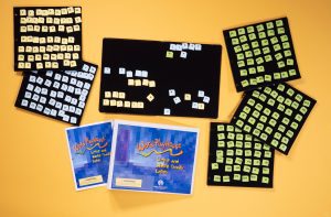 Word PlayHouse kit laid out including binder, black felt boards, and yellow and white word manipulatives.
