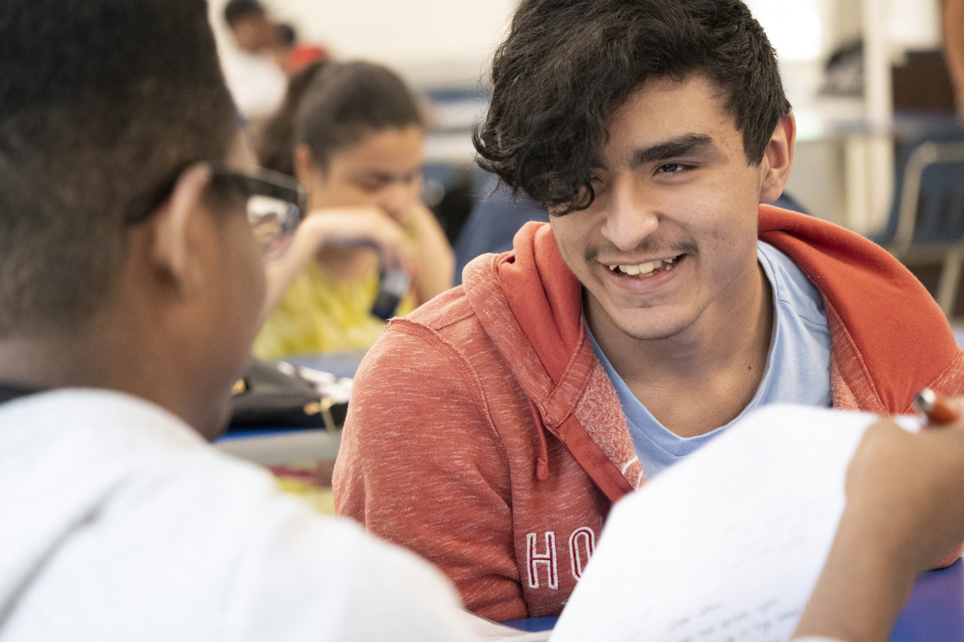 several teenage students in a classroom setting