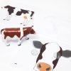 Cow translucent puzzle pieces, print and tactile overlays, and plastic model from the Animal Recipes Farm Set.