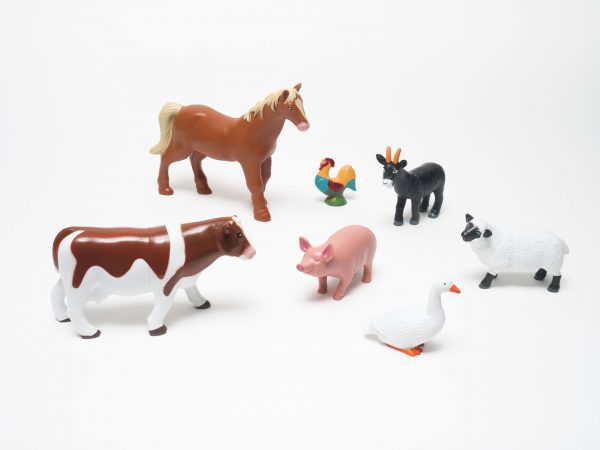 Cow, horse, chicken, goat, pig, sheep, and duck puzzle pieces, print and tactile overlays, and plastic model from the Animal Recipes Farm Set.