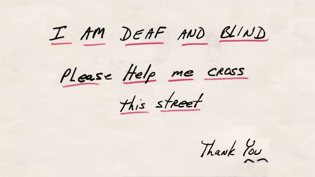 A piece of paper with words in black ink, underlined in red, reading 