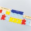One strand of messenger RNA (from the DNA-RNA Kit) comprising three nucleotide triplets (AUG, CCC, UGA) lined up with complementary transfer RNA subunits (UAC, GGG) with attached amino acids (methionine and proline) along with a Stop Release Factor subunit (from the Protein Synthesis Kit).