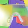 Close up of safety glasses containing the cataracts insert in front of a tactile map of the United States. This image gives an idea of how an individual with cataracts would see the map