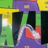 Close up of safety glasses containing the Detached Retina insert in front of a tactile map of the United States. This image gives an idea of how an individual with Detached Retina would see the map.