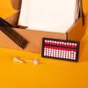 student starter pack box containing abacus, transcribing paper, and cell slate with saddle stylus