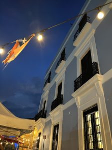 Classic building on wall in Old San Juan with weathered flag of Puerto Rico.