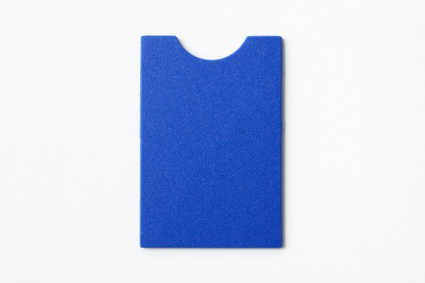 Single, undrilled blue “puzzle”-shaped card