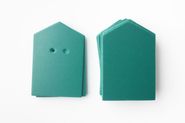 A package of green “house”-shaped cards (10 undrilled and 5 two-hole drilled)