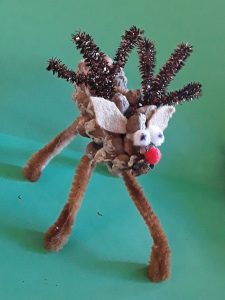 Small Reindeer made out of a pinecone and pipe cleaners.