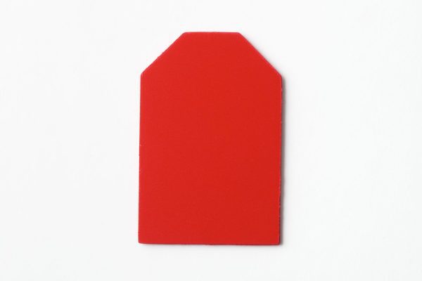 Single, two-hole drilled red “barn”-shaped card