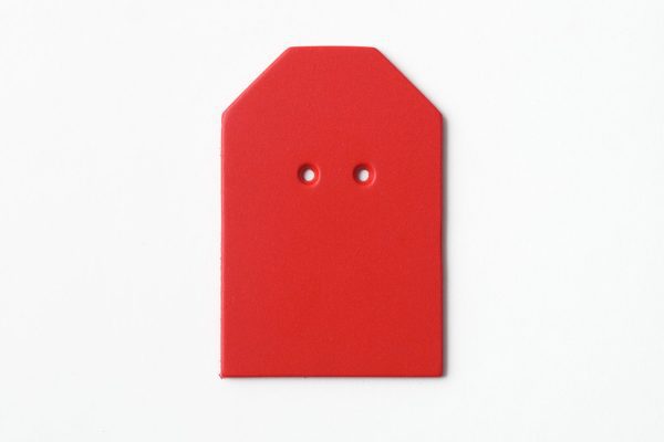 Single, two-hole drilled red “barn”-shaped card