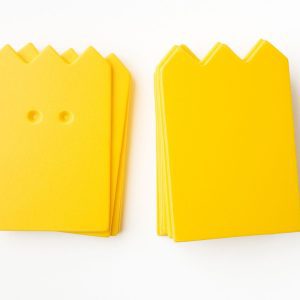 A package of yellow “crown”-shaped cards (10 undrilled and 5 two-hole drilled).