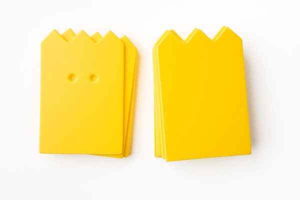 A package of yellow “crown”-shaped cards (10 undrilled and 5 two-hole drilled).