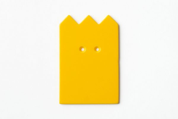 Single, two-hole drilled yellow “crown”-shaped card