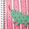 A tactile image of baby lizard on a pink background, with black squiggly lines and ovals. Baby lizard has rough green skin and is sticking his bright red tongue in the air. One of baby lizard’s black eyes is visible.