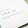 The book is opened to show a page of large print and braille text. The text reads in both print and braille, “But one day, someone took my tail… and now I feel a bit bizarre!”