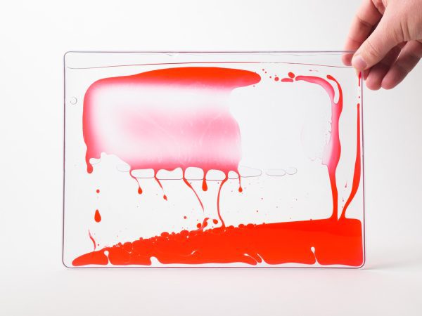 Zoomed out image of a red swirly mat over a white background.