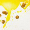 Close up of a yellow swirly mat with smiley faces and glitters inside the mat.