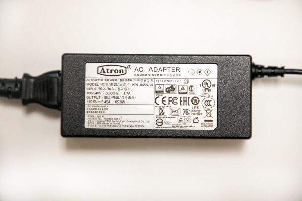 Close up of a black Jupiter AC Adapter