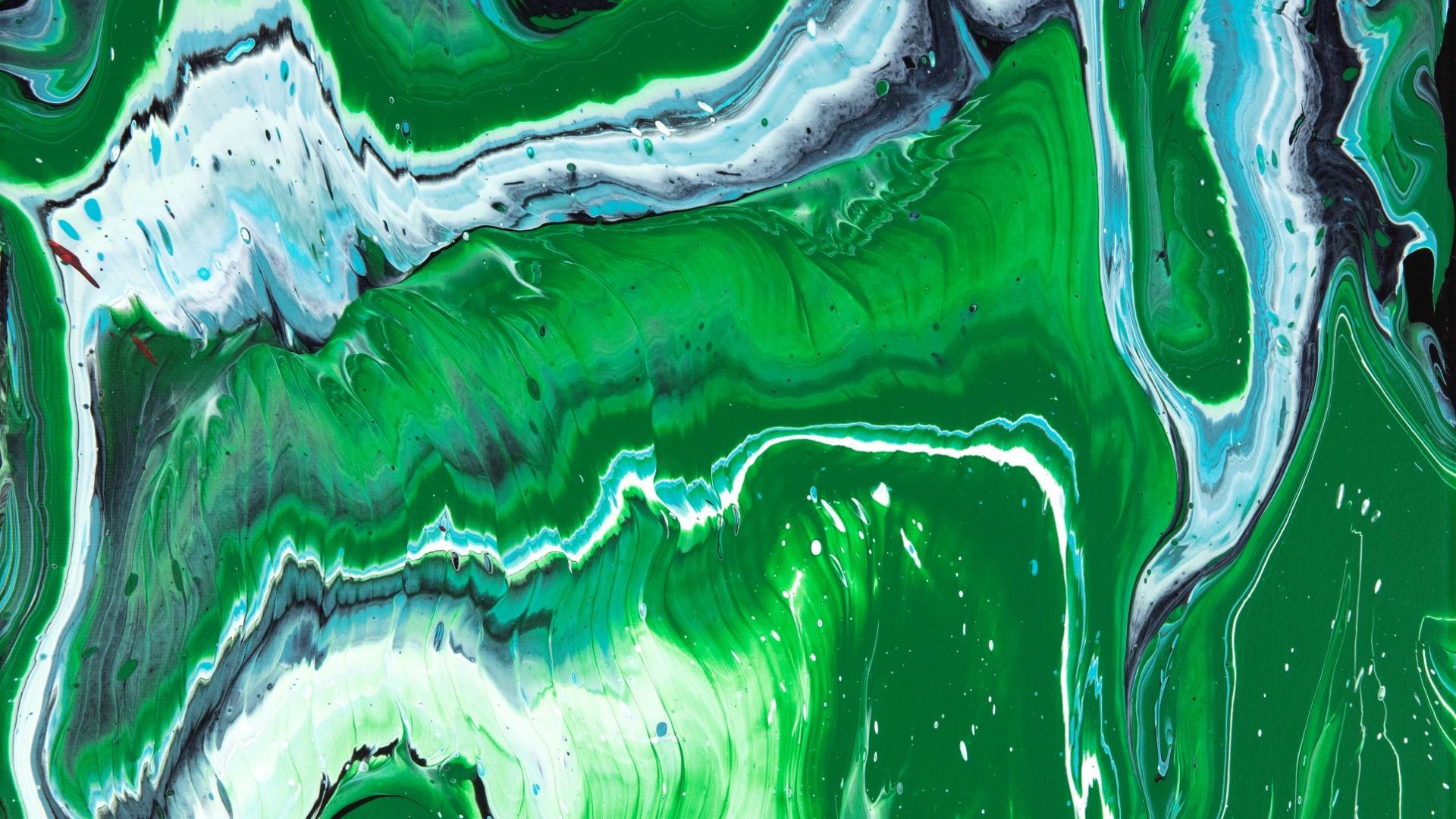 Utilizing a pouring technique with bright green, teal, black, and white acrylic paints, Wichman’s “Grassy Knoll,” measuring at 11 by 14 inches, moves with highly marbleized swirls throughout the canvas. The green is so bright and prevalent that one might start to smell fresh grass blades that make up one of the painting’s many swirls.