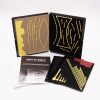 Light In-Sight Kit displaying a black working board with yellow stick-on drawing pieces that represent light reflection and refraction concepts. Two storage panels with different diagrams and an instruction booklet lay spread out in front of the working board.