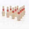 Ten bowling pins with red stripes arranged in a triangle formation.