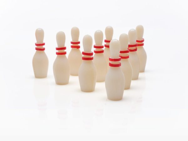 Ten bowling pins with red stripes arranged in a triangle formation.