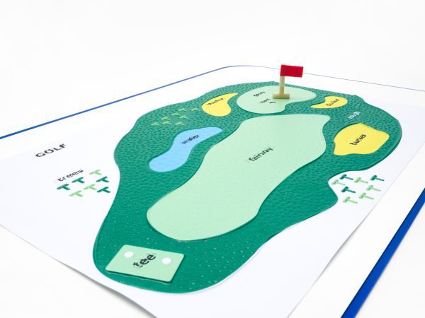 Sports Court's golf tactile layout. A red flag sits on the green. Different sections of the course are denoted with print and tactile labels as well as changes in surface texture.