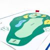 Sports Court's golf tactile layout. A red flag sits on the green. Different sections of the course are denoted with print and tactile labels as well as changes in surface texture.