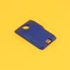 Overhead view of the blue digital talking book cartridge on a yellow background. The cartridge has a circular hole on one end and a USB port on the other, and it reads "4GB."