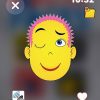 A smiling animated yellow man with spikey pink hair. He has his left eye closed and his right eyebrow raised.