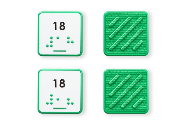 Comparison of two green square number tiles showing the differences between UEB and Nemeth for the number 18.