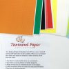 A stack of multi-colored textured paper fanned out with the textured paper insert positioned underneath.