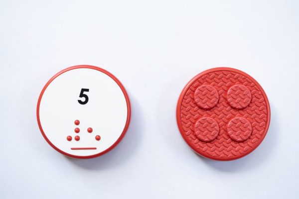 Front and back of red circular Reach & Match Number tile showing the number 5 in Nemeth braille and print. The back side is textured.