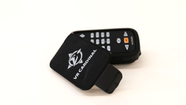 A VR Cardinal device with the cover half open sitting on a white background. On the cover is a white VR Cardinal logo with the words “VR CARDINAL