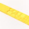 The yellow transparent tactile shape slate laid closed on a white background. The slate has cut outs of circles, triangles, squares and more in various sizes.