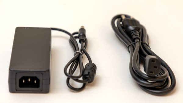 The two components (power adapter and power cord) that make up the Polly power supply on a white background.