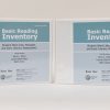 Two three-ring Basic Reading Inventory binders standing on a white background. The blue covers are labeled "Uncontracted Braille" on the left and "Contracted Braille" on the right. Both say "Basic Reading Inventory - Student Word Lists, Passages, and Early Literacy Assessments" and list the authors.