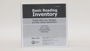 A three-ring Basic Reading Inventory binder labeled