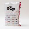 The Memory Puzzles: Shapes (Spanish) carrying pouch standing up on a white background. The front label contains drawings of all the shapes contained in the set.