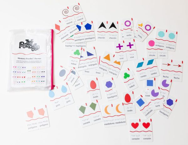 The 52 pairs of Memory Puzzles: Shapes (Spanish) spread out on a white background next to the pouch they come in.
