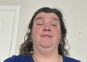 Jennifer smiles into the camera.