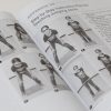 Two opened pages of PE and Sports with photos of a girl demonstrating how to do adapted jumping jacks.