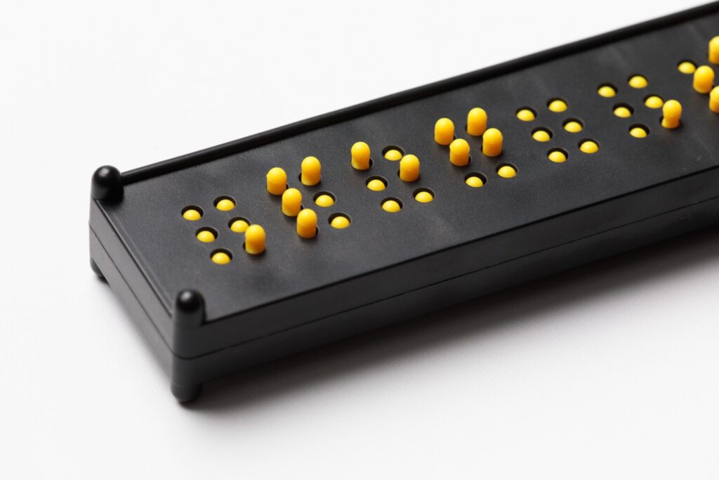 The black and yellow peg slate placed on a white background.